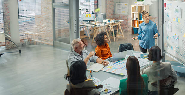 Woman leading creative planning for a team