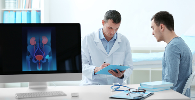 Urologist discusses medical information with a young male patient
